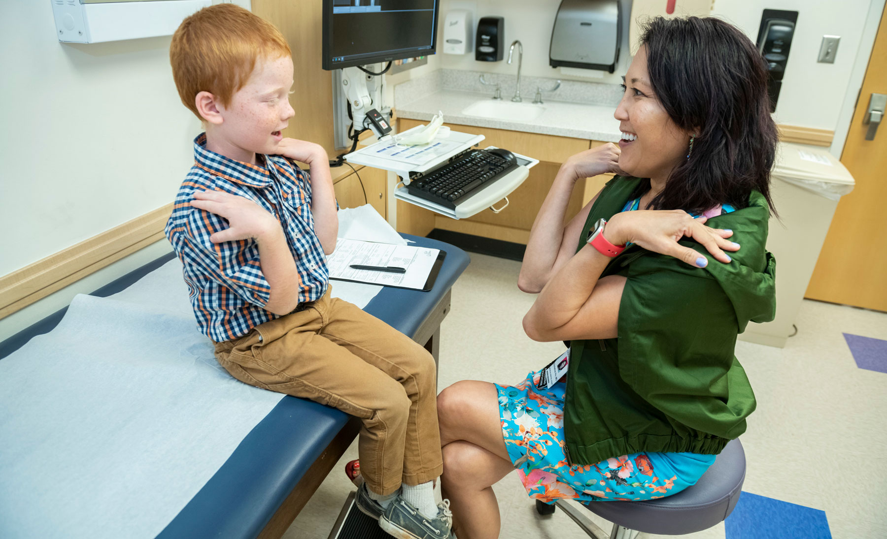 Doctor Examining Young Patient