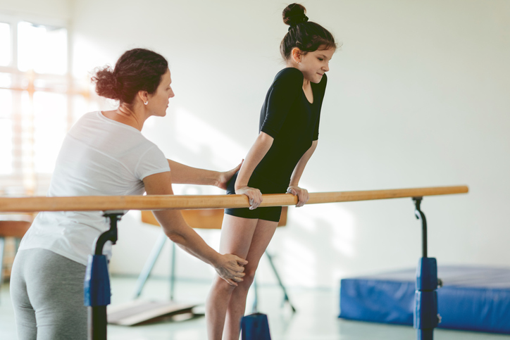 Gymnast and coach