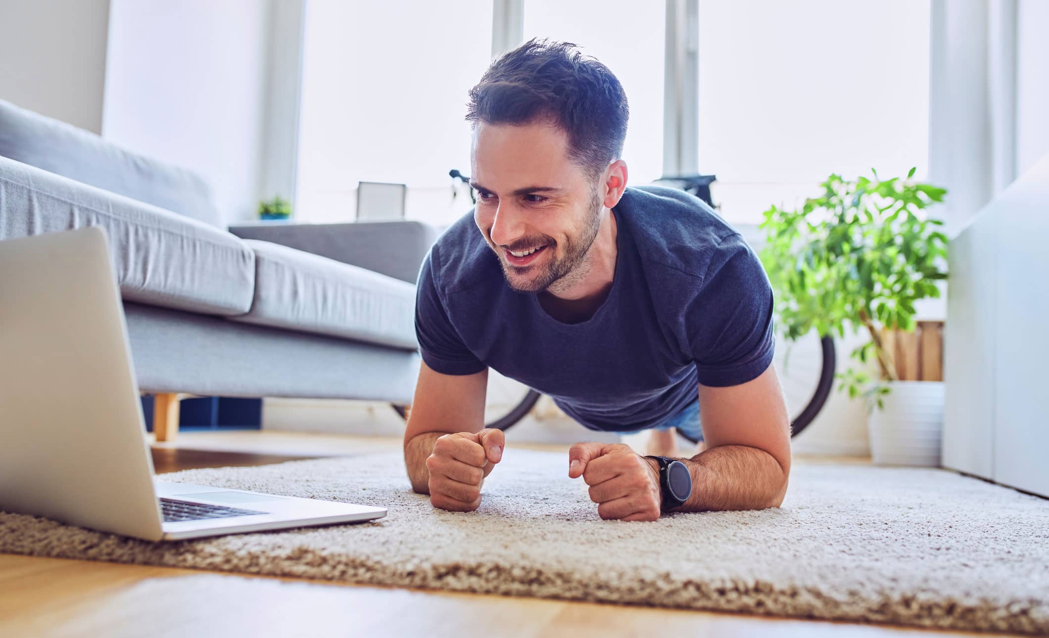 man doing a plank exercise at home